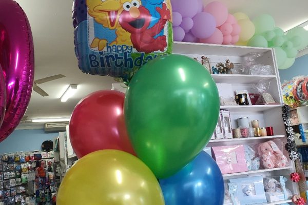 45cm square Sesame Street Happy Birthday foil balloon with 2 rows of 2 balloons (red, green, yellow & blue).